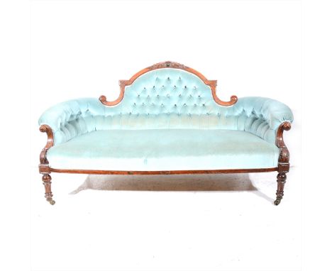 A Victorian walnut sofa, upholstered in sky blue button dralon, carved cresting, ringed and fluted legs, width 185cm.