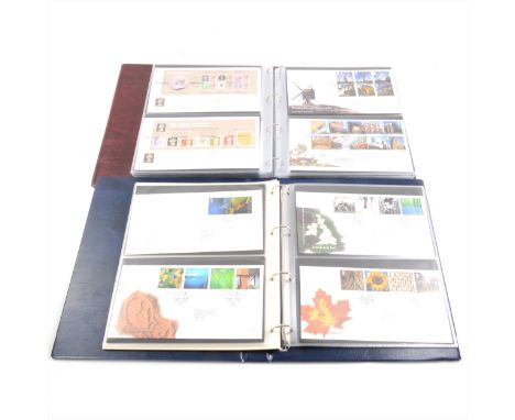 Eight burgundy albums of "Royal Mail First Day Covers" 1980's -2000's, two blue albums of "Royal Mail Millennium Collection" 