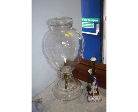 A glass urn and a candlestick