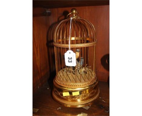 A Reuge music Sainte Croix clockwork automaton of two birds in a cage. 28cm height