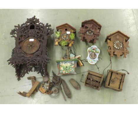 Interesting early Black Forest cuckoo clock case, 22" high; also five contemporary Black Forest clocks and some older part cl