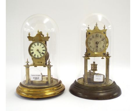 Interesting old German torsion clock, the 2" cream dial over a disc pendulum, upon a stepped circular base and under a glass 