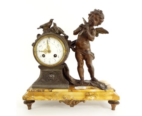 French spelter and yellow marble two train figural mantel clock, the movement with outside countwheel striking on a bell, the