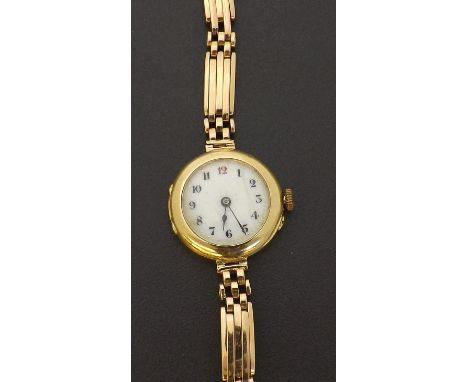 Early 20th century 15ct lady's bracelet watch, import hallmarks London 1915, the dial with Arabic numerals and red twelve, 15