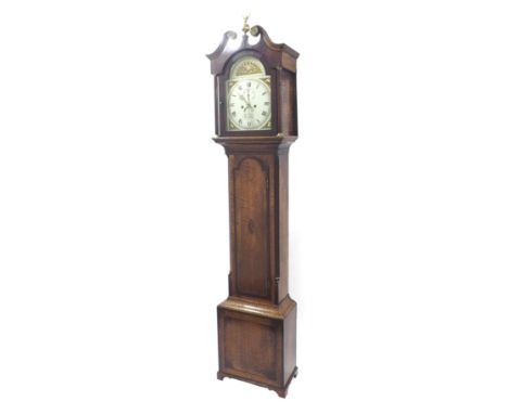 Oak and mahogany crossbanded eight day longcase clock, the 12" painted arched dial with raised centre signed Thomas Wilson, P