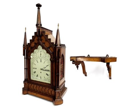 Oak Gothic style triple fusee bracket clock and bracket, the movement striking on a large gong and playing on a nest of eight