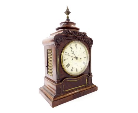 English mahogany double fusee bracket clock striking on a bell, the 7" convex cream dial within a foliate carved panelled cas