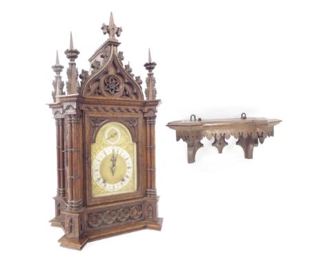 Gothic oak two train ting-tang bracket clock with bracket, the W & H movement striking on two gongs, the 6" brass arched dial