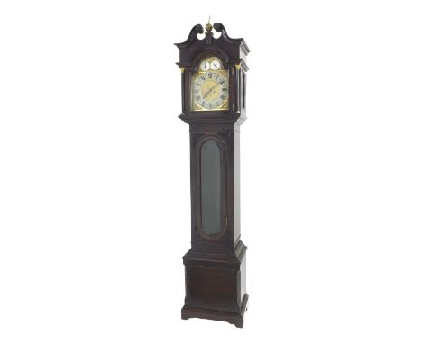 Mahogany three train spring driven longcase clock, the movement striking on five tubular bells, the 12" brass arched dial wit
