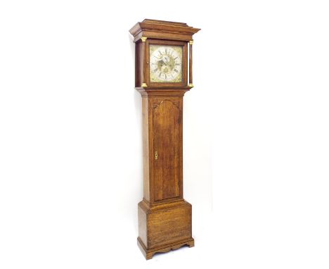 Oak eight day longcase clock, the 12" brass arched dial signed Joseph Atkinson on the silvered chapter ring enclosing an engr