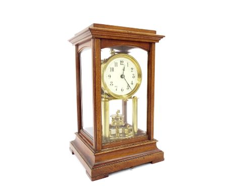 Gustav Becker mahogany and four glass torsion clock, the 3.25" cream dial over a disc pendulum and within a bevelled glazed s