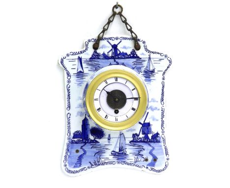 Dutch ceramic wall timepiece, the 3.5" white dial within a drumhead casing and shaped ceramic surround painted with sailing b