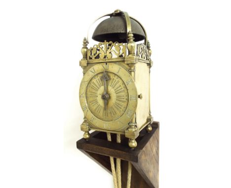 Antique English brass hook and spike lantern clock, the 5.75" chapter ring enclosing a geometric engraved centre with single 