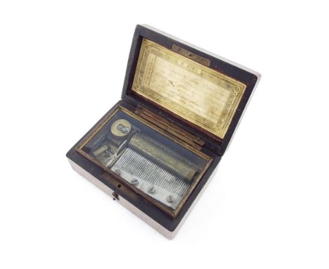 Miniature music box playing on six airs and with original tune sheet, within a rectangular wooden banded case, 5" wide (key)