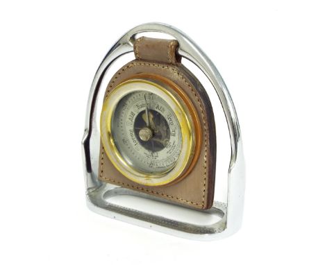 Small aneroid desk barometer, the 2.25" silvered dial with skeletonised centre within a metal casing and suspended within a l