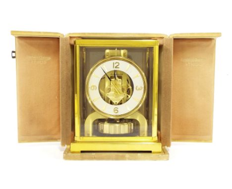 Jaeger-LeCoultre Atmos clock, the 4.25" cream dial enclosing a skeletonised centre, within a four glass and gilt metal canted