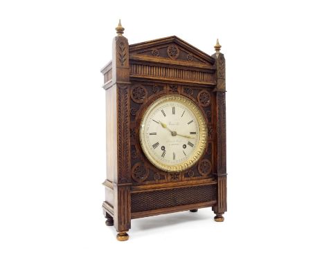 Arts & Crafts style oak two train mantel clock, the 5.5" silvered dial signed Russells', 18, Church Street, Liverpool, the mo