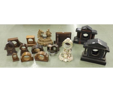 Various mantel clock cases including two black slate, porcelain, spelter and eleven various small, mainly wooden mantel clock