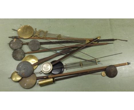 Quantity of various wall clock pendulums (over ten)