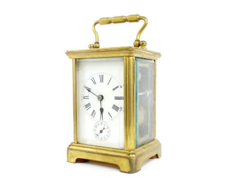 Small French alarm carriage clock striking with two hammers on a gong, within a corniche brass case, 6" high