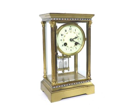 French brass four glass two train mantel clock striking on a gong, the 3.5" cream dial over a mercury pendulum, within a glaz
