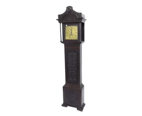 Carved oak thirty hour longcase clock, the 11" square engraved brass dial signed Benjamin Andrew, St. Austle with arched cale