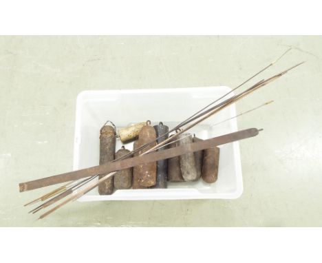 Quantity of various size longcase clock weights (10); also several longcase clock pendulum rods