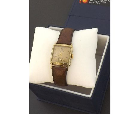 Omega 1940s 14k gold filled square curved mid-size wristwatch, gilded dial with Roman numerals, dot markers and subsidiary se