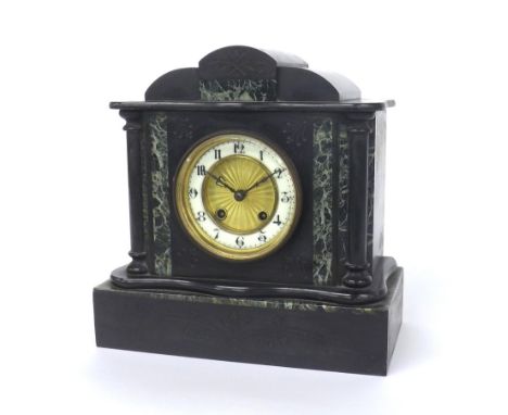French black slate and green marble two train mantel clock striking on a gong, the 3.75" white dial enclosing a recessed engi