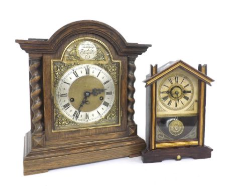 Junghans oak three train mantel clock playing on four rods, the 7" brass arched dial with silvered chapter enclosing a matted