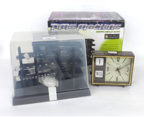 Kinetic display (rolling ball) clock in original box and packing; also a Rhythm alarm/calendar clock within a Bakelite case (