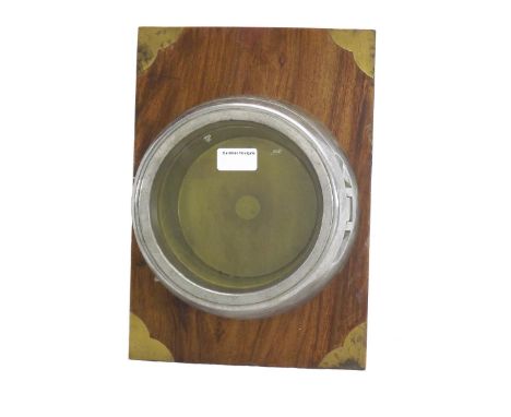 Russian submarine empty alloy wall clock case with aperture for a 6.5" dial, fixed to a wooden rectangular board with brass i