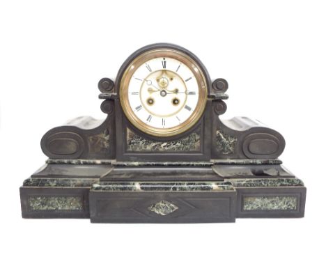 French black slate and green marble two train mantel clock striking on a bell, the 4.5" white chapter ring enclosing a recess