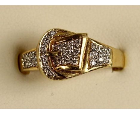 An 18ct gold and diamond buckle ring, pave set with brilliant cut stones, size S, 5.5 gms. 