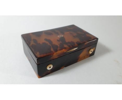 A 19th century French silver and gold mounted tortoiseshell musical box, playing two tunes, bearing control marks, 9 x 5.5 x 