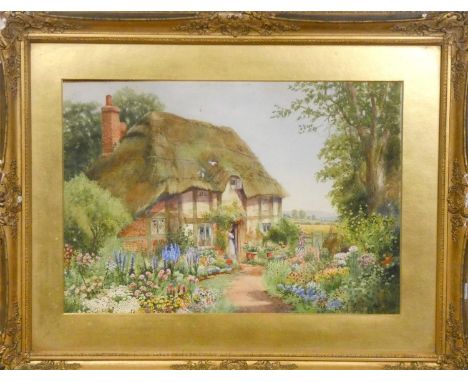Arthur Wilkinson (1860-1930), Thatched cottage and garden, signed, watercolour, 36 x 50 cm.