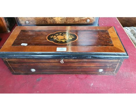 A 19th century Swiss music box in a faux rosewood and boxwood inlaid case, single comb movement number 163, 51 x 21 x 16 cm, 