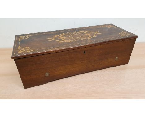 Lecoultre and Granger A 19th century Swiss music box, rosewood case with boxwood inlay, single comb movement numbered 3804. 5