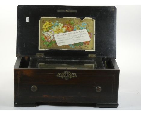 A 19th century Swiss music box playing 6 airs the movement in need of restoration, numbered 31065.  35 x 19 x 15 cm Not worki