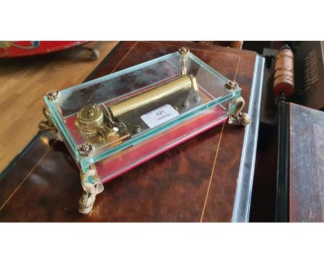 A music box by Reuge of Switzerland, with glass panels and gilt mounts, playing The Thieving Magpie, 23 x 15 x 6 cm, working 