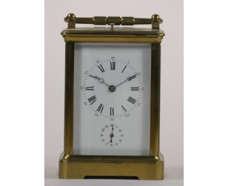 A brass carriage striking, repeating and alarm clock, the white enamel dial unsigned, subsidiary seconds alarm dial, the move