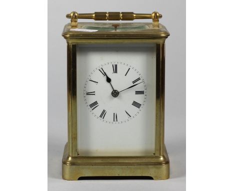A large brass repeating carriage clock, the white enamel dial unsigned, the movement striking the hours, not working, height 