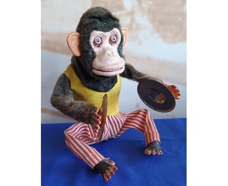 A Japanese battery operated mechanical monkey playing the cymbals, 28 cm. 