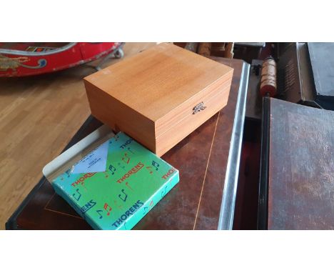 A polyphon box by Thorens, with various discs, 19 x 16 x 8 cm. 