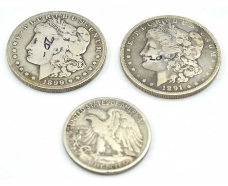 Three American silver coins to include 2x Morgan Dollars: 1891 O mint and 1899 S mint together with 1944 silver liberty half 