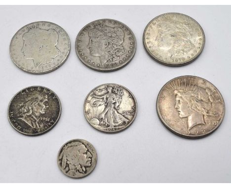 Quantity of Seven American silver coins to include three Silver Morgan Dollars: 1878,1880 and 1886, 1922 American Liberty Dol