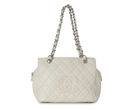 Chanel, a Petite Timeless Tote, crafted from white caviar leather with diamond quilted detailing and embroidered CC logo to t