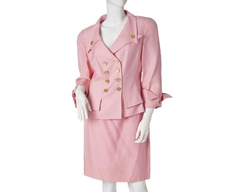 Nina Ricci, a 1990s pink skirt suit, comprising a double-breasted fitted jacket with gold-tone detailed buttons, and a matchi