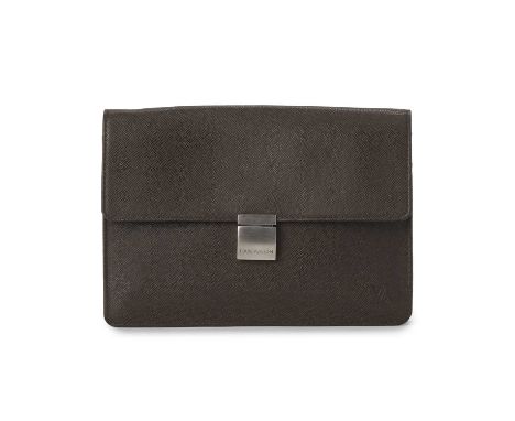 Louis Vuitton, a Selenga clutch, crafted from brown taiga leather, with brushed silver-tone hardware, flap closure with front