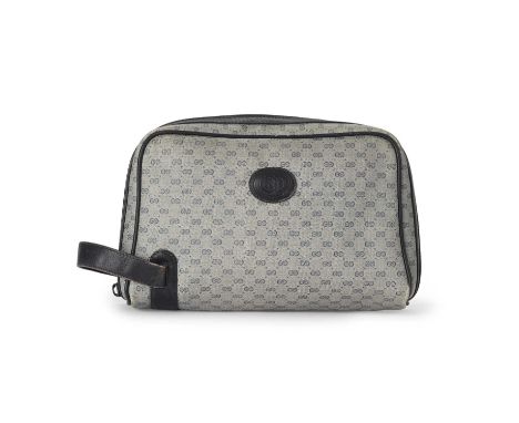 Gucci, a vintage toiletry pouch, featuring the maker's micro monogram coated canvas exterior, with navy blue leather trim, sm